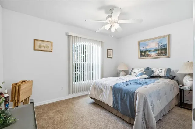 a view of a house with pool and chairs