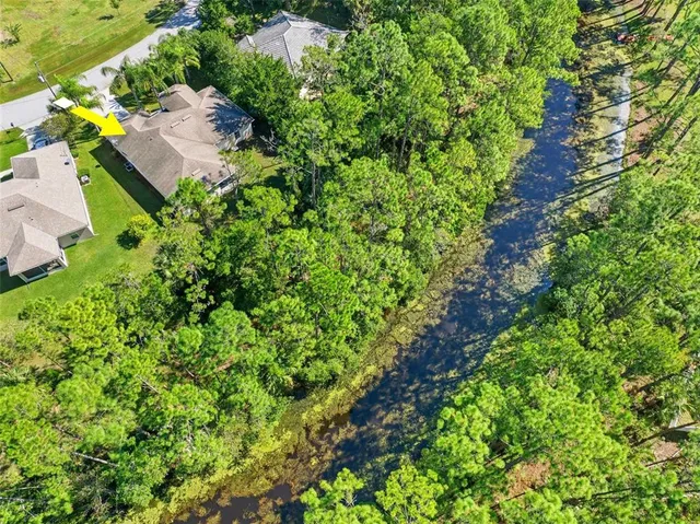 an aerial view of residential house with outdoor space