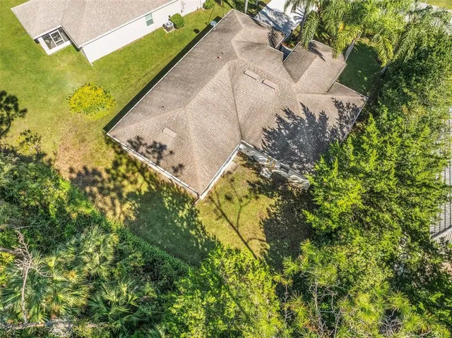 a view of a garden with a building in the background