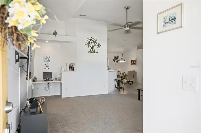 a view of livingroom with furniture and workspace