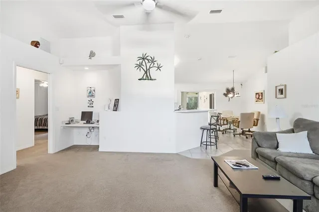 a living room with furniture and white walls