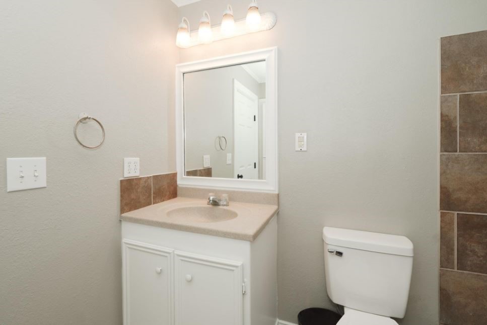 701 Clay Street Cleveland, TX 77327 - Photo 13 of 18 Vanity with sink, new toilet