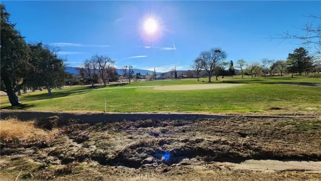 a view of a golf course with a building