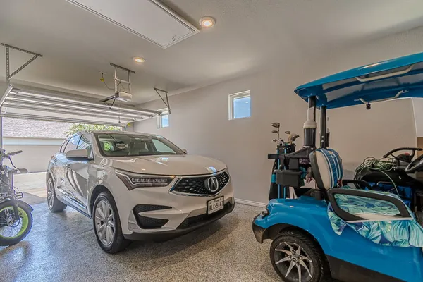 a car and bike parked in a room