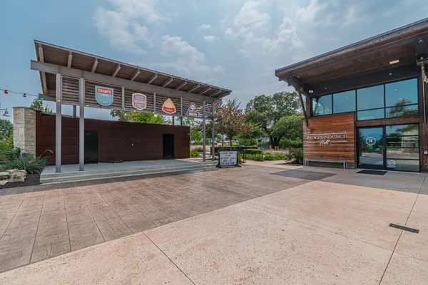 a front view of building with street