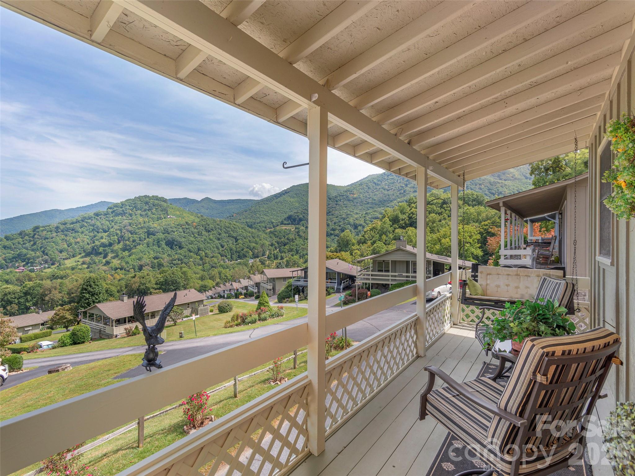 21 Flint Lane Maggie Valley, NC 28751 - Photo 2 of 30 a view of balcony with couch and wooden floor