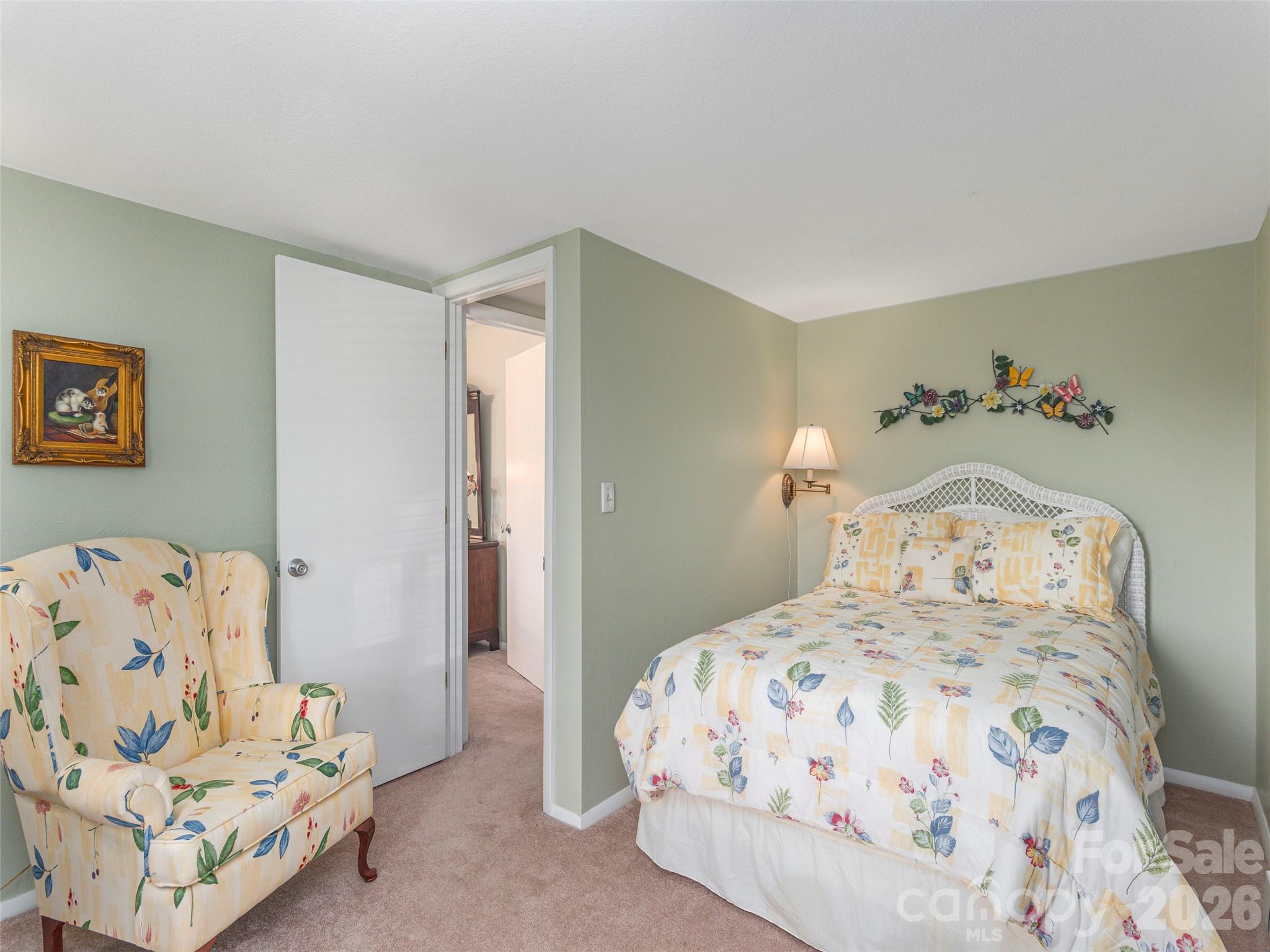 21 Flint Lane Maggie Valley, NC 28751 - Photo 23 of 30 a bedroom with a bed and a couch
