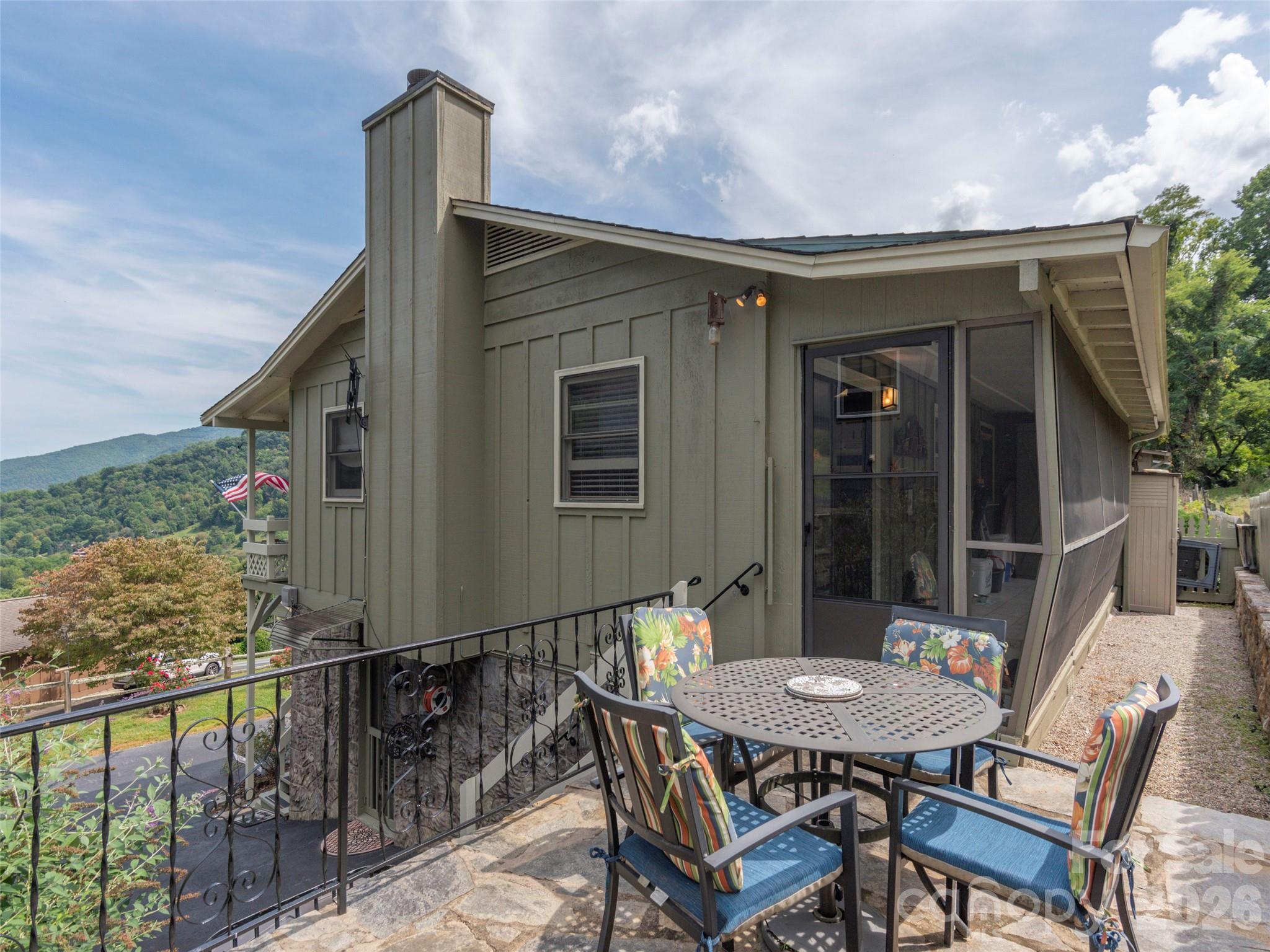 21 Flint Lane Maggie Valley, NC 28751 - Photo 26 of 30 a backyard of a house with table and chairs