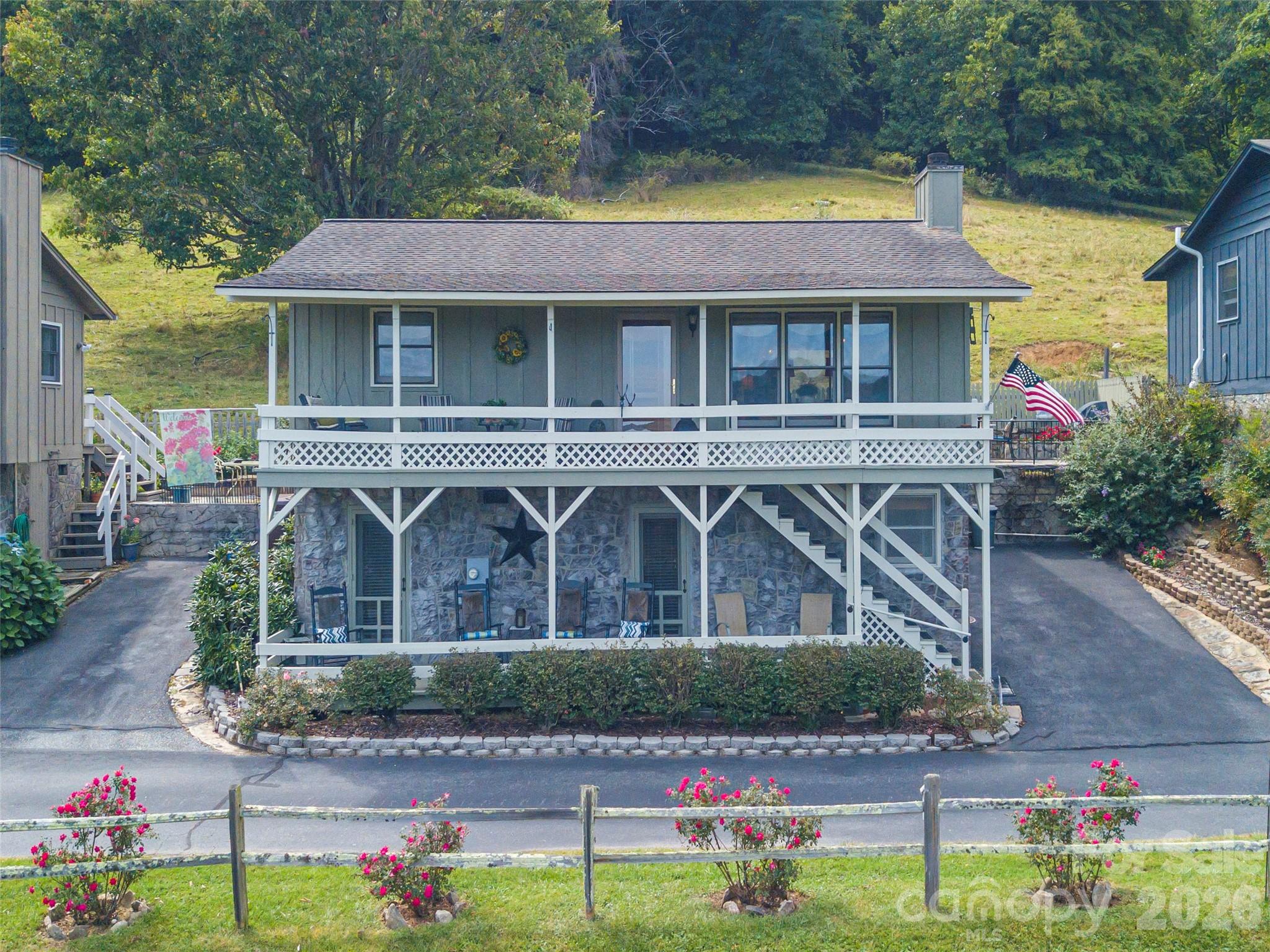 21 Flint Lane Maggie Valley, NC 28751 - Photo 4 of 30 a front view of a house with garden