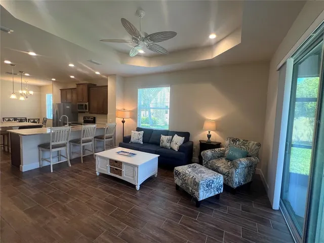 a bedroom with a bed two lamps and a window