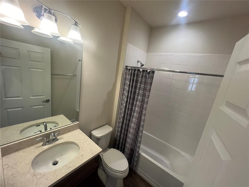 9912 Sheltering Spruce Street Englewood, FL 34223 - Photo 30 of 55 a bathroom with a sink toilet and shower