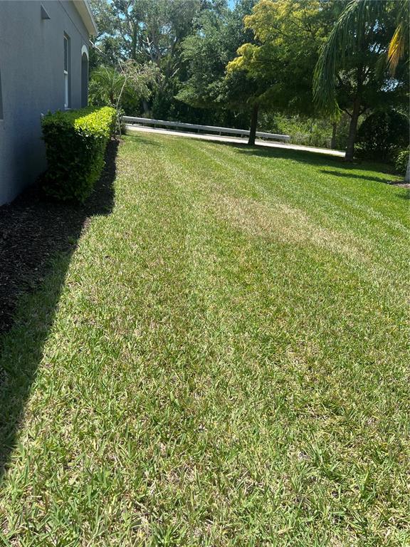 9912 Sheltering Spruce Street Englewood, FL 34223 - Photo 44 of 55 a view of outdoor space with garden