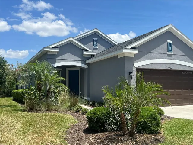 a view of a patio with a table and chairs