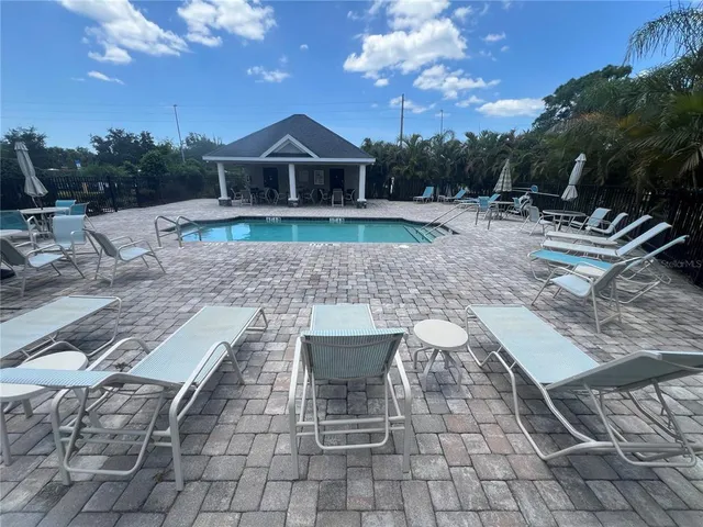 a kitchen with a table and chairs in it