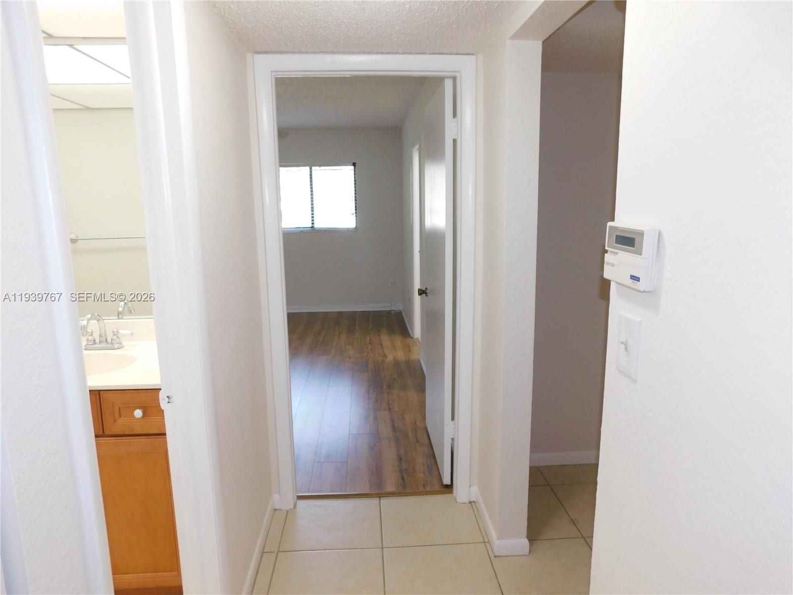 8015 Southwest 107th Avenue, Unit 111 Miami, FL 33173 - Photo 15 of 22 hallway to master and 2nd bedrooms