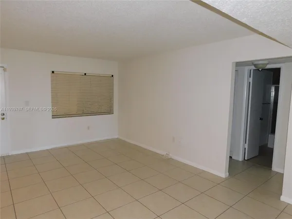 an empty room with a bench