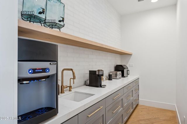 a view of a bedroom with wooden floor and closet