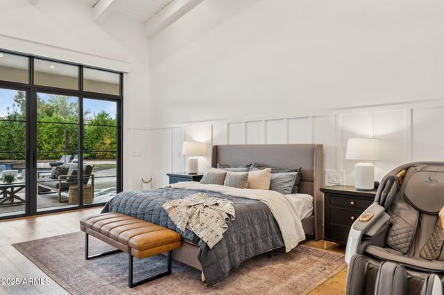 a bathroom with a double vanity sink mirror and bathtub