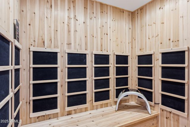 a bathroom with a sink vanity mirror and toilet
