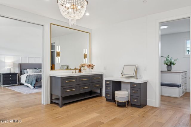 a bedroom with a bed and a potted plant