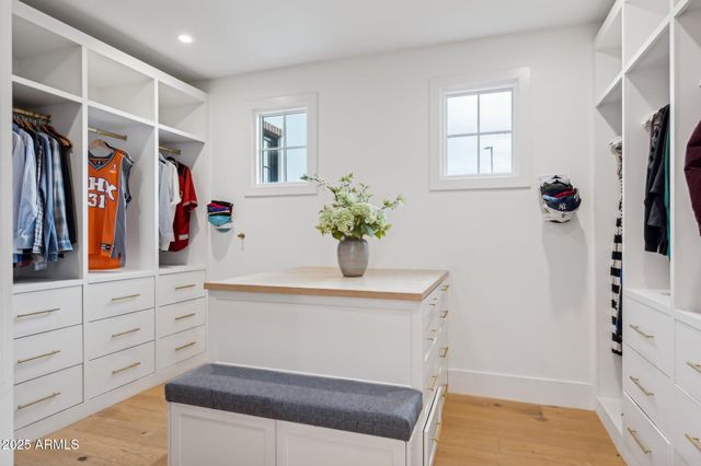 a bathroom with a sink a shower and a mirror