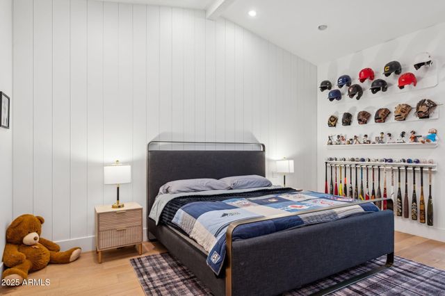 a room with round mirror and cabinets