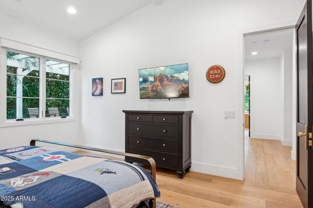 a outdoor space with patio fireplace couches and a fireplace with the potted plants