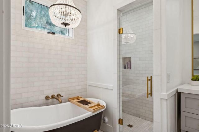 a view of a swimming pool with a lounge chair and a yard