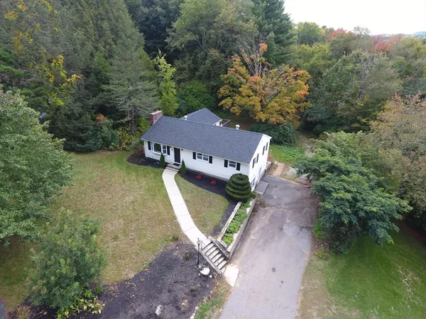 an aerial view of a house with a garden