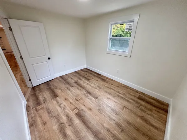 a view of a room with a bed and closet