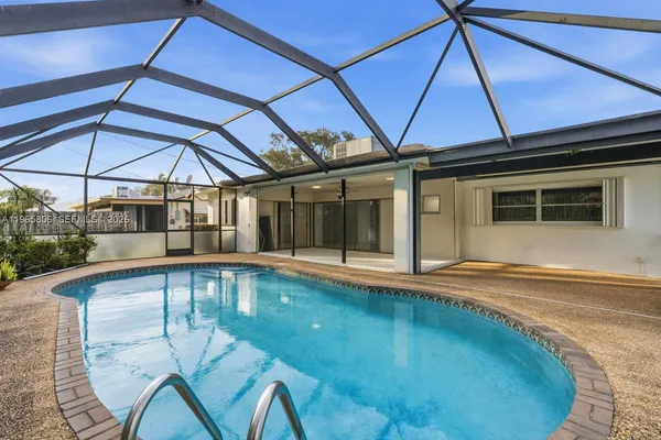 a view of a swimming pool with a patio