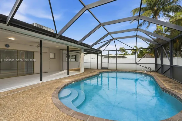 a view of a swimming pool with a patio