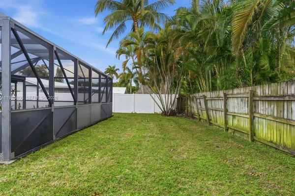 a view of backyard with green space