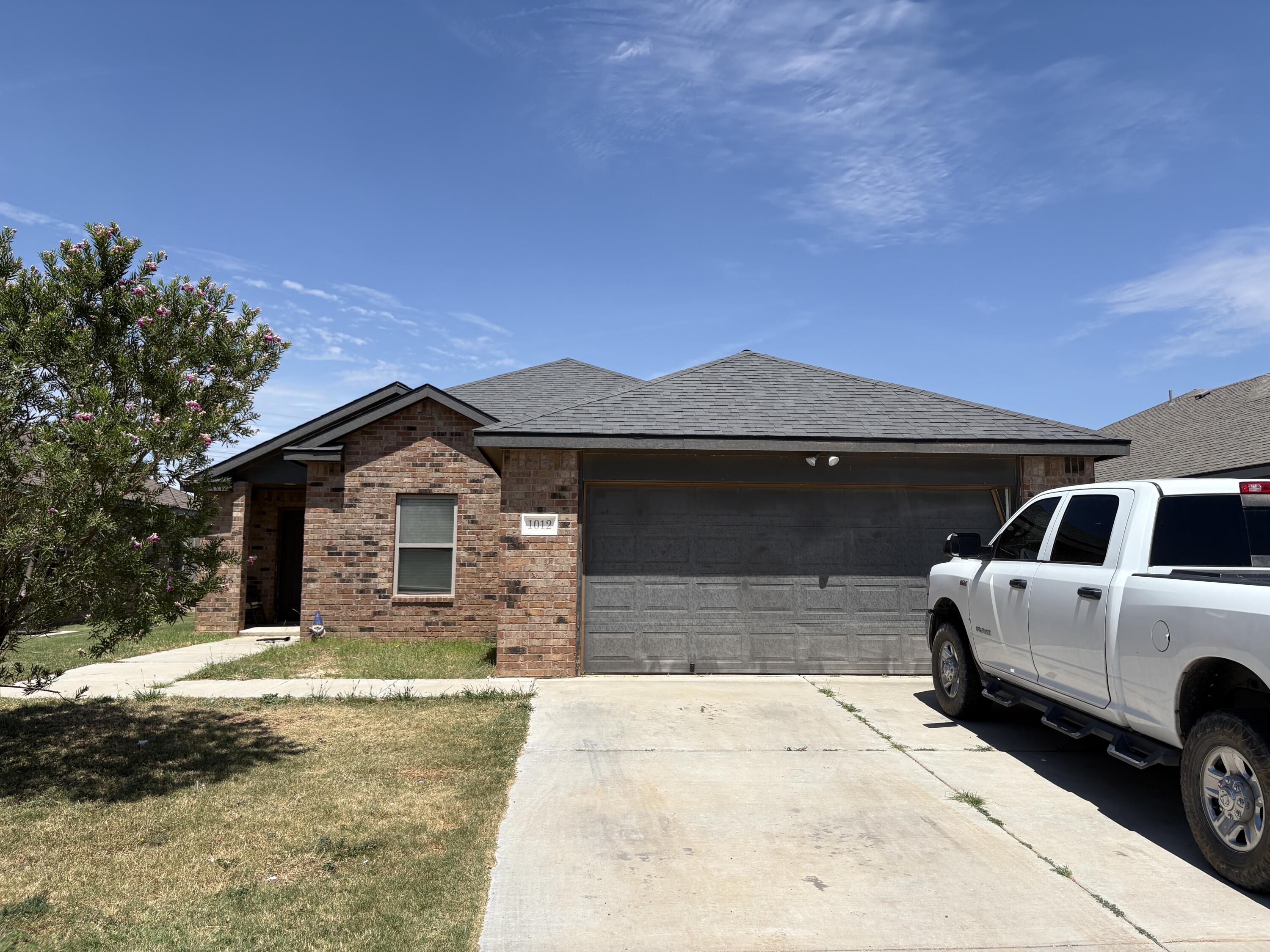 1012 Preston Trail Wolfforth, TX 79382 - Photo 1 of 21 a front view of a house with parking space