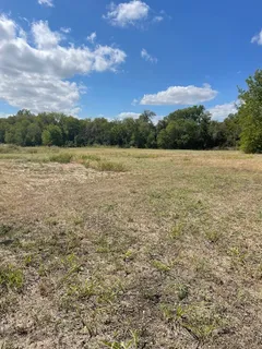 a view of lake with lots of green space