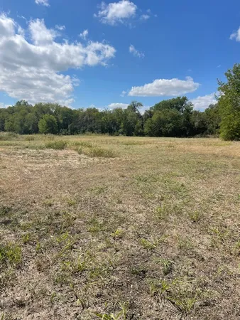 a view of lake with lots of green space