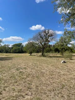 a view of lake with green space
