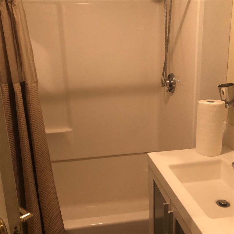 27 High Street, Unit 1 Clinton, MA 01510 - Photo 21 of 30 a bathroom with a sink and a shower