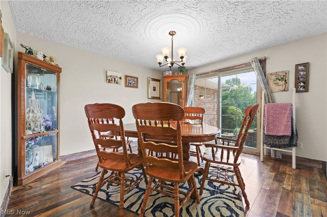 1761 May Road Mogadore, OH 44260 - Photo 6 of 46 Dining area with wood-finish flooring and light-toned walls