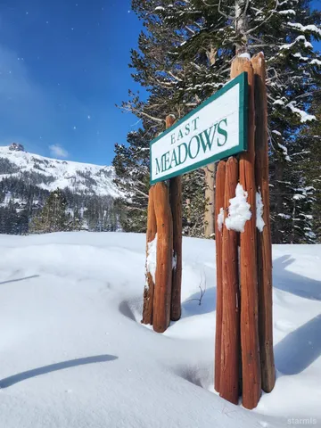 a view of street sign of the road and city view
