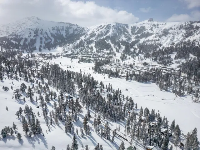 a view of mountains covered with snow