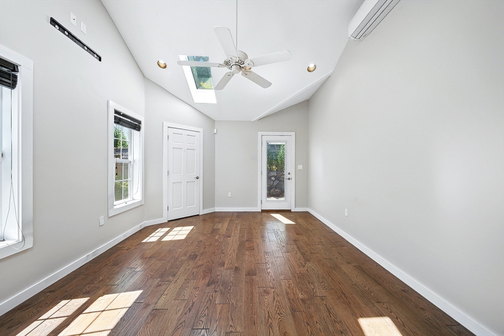 13 Oak Street Salem, MA 01970 - Photo 12 of 42 a view of an empty room with wooden floor and a window