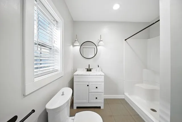 a bathroom with a sink a toilet and a bathtub