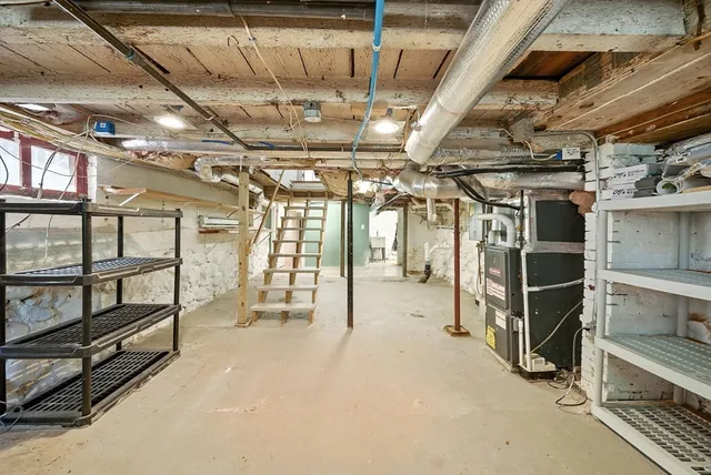 a view of an empty room with wooden ceiling