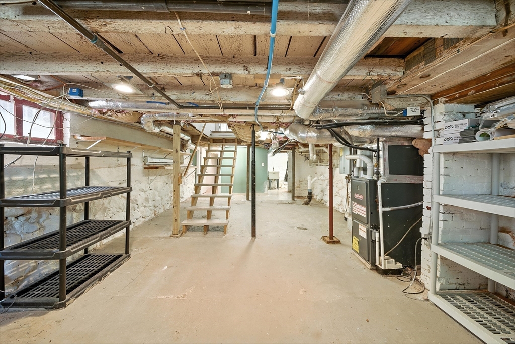 13 Oak Street Salem, MA 01970 - Photo 28 of 42 a view of an empty room with wooden ceiling