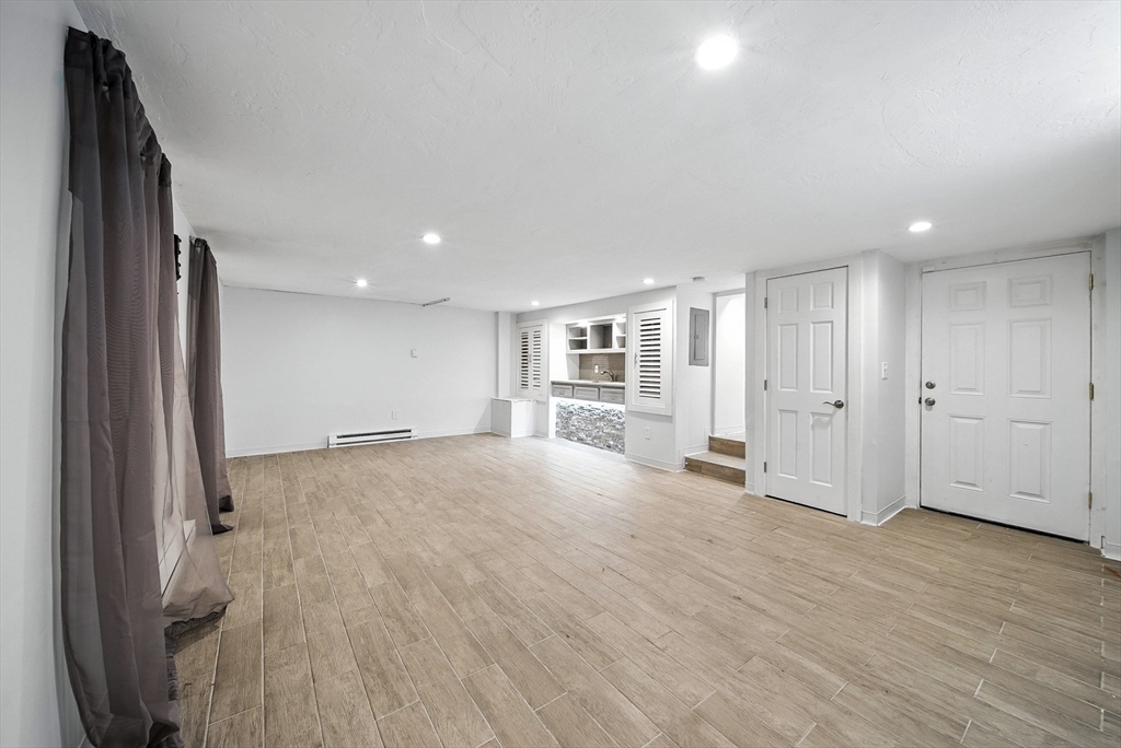 13 Oak Street Salem, MA 01970 - Photo 30 of 42 a view of empty room with wooden floor