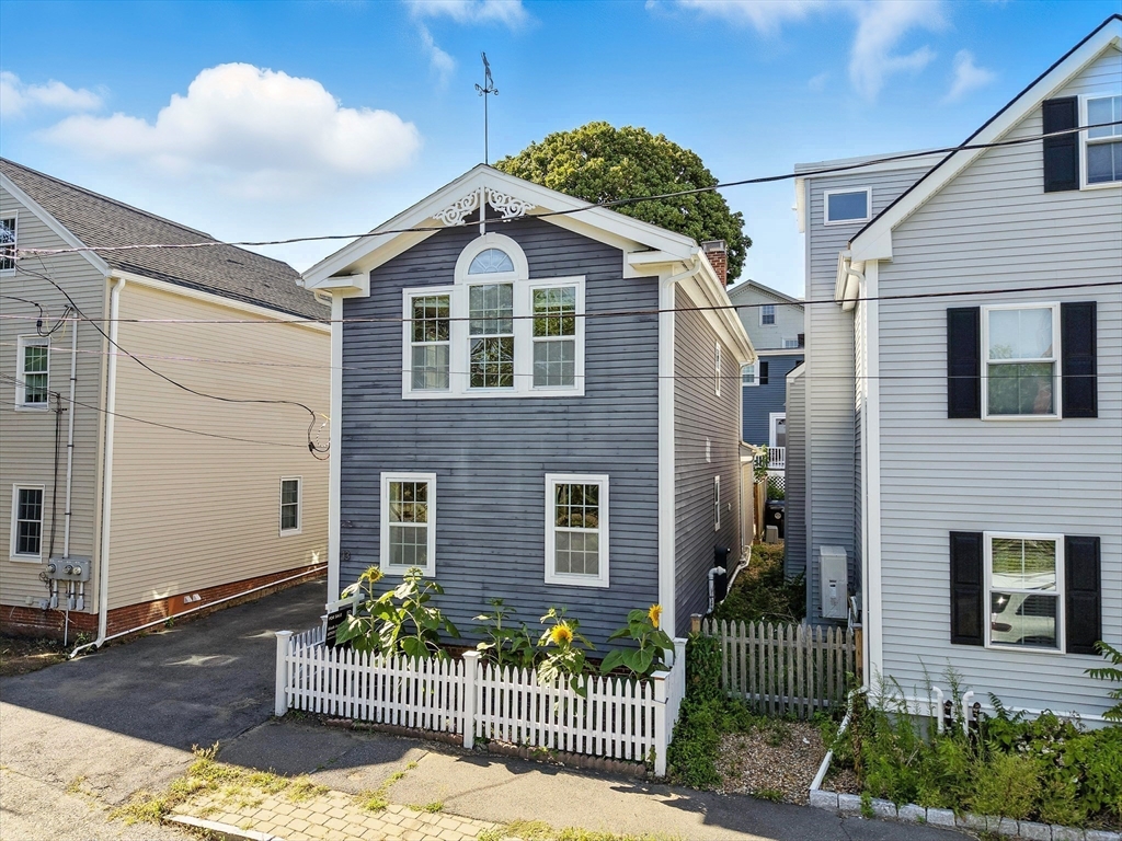 13 Oak Street Salem, MA 01970 - Photo 36 of 42 a front view of a house with garden