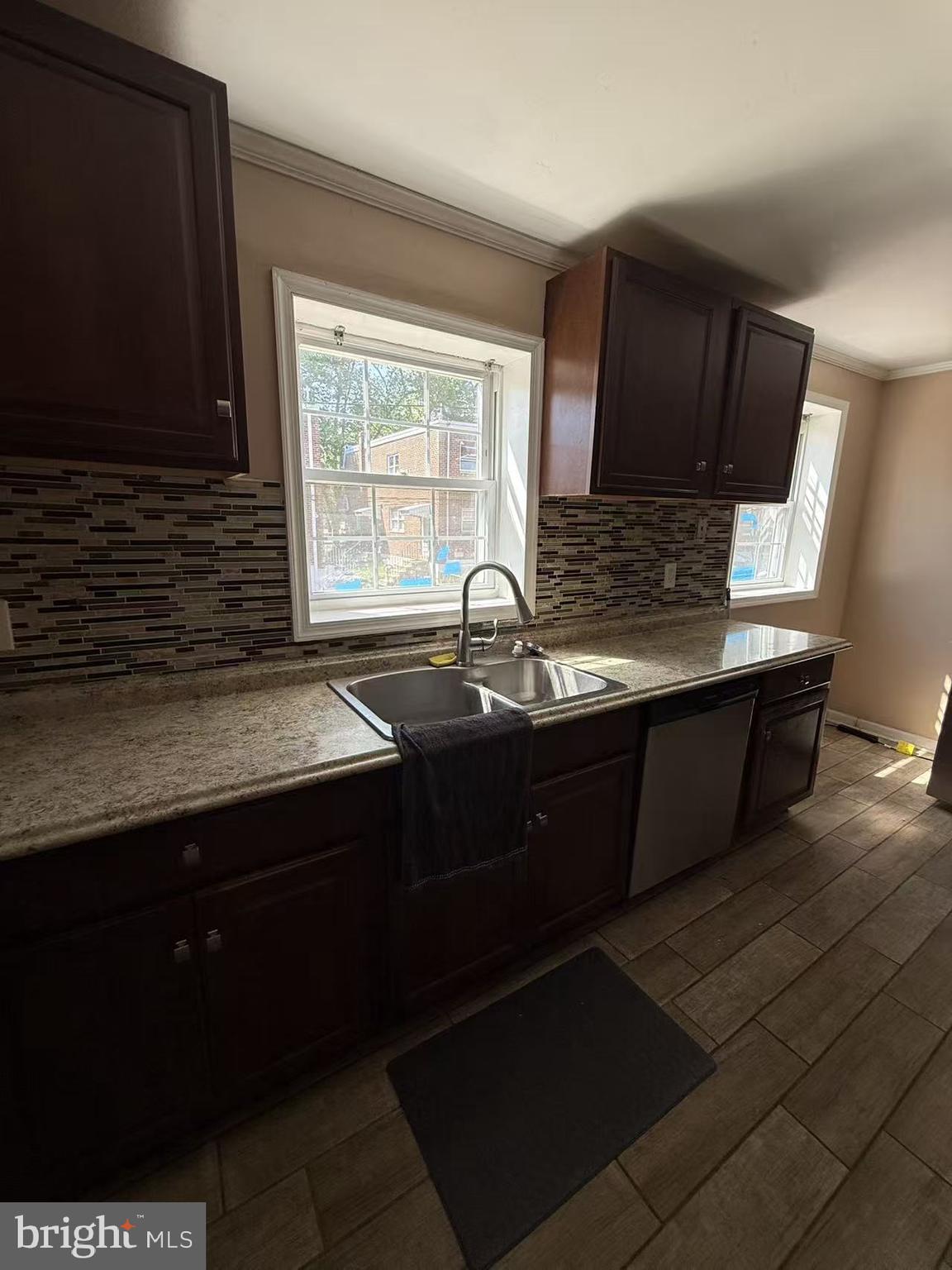 7640 Fairfield Street Philadelphia, PA 19152 - Photo 11 of 24 a kitchen with a sink cabinets and a window