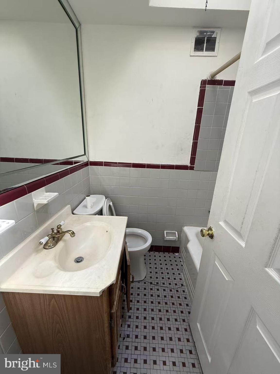 7640 Fairfield Street Philadelphia, PA 19152 - Photo 18 of 24 a bathroom with a sink and a mirror