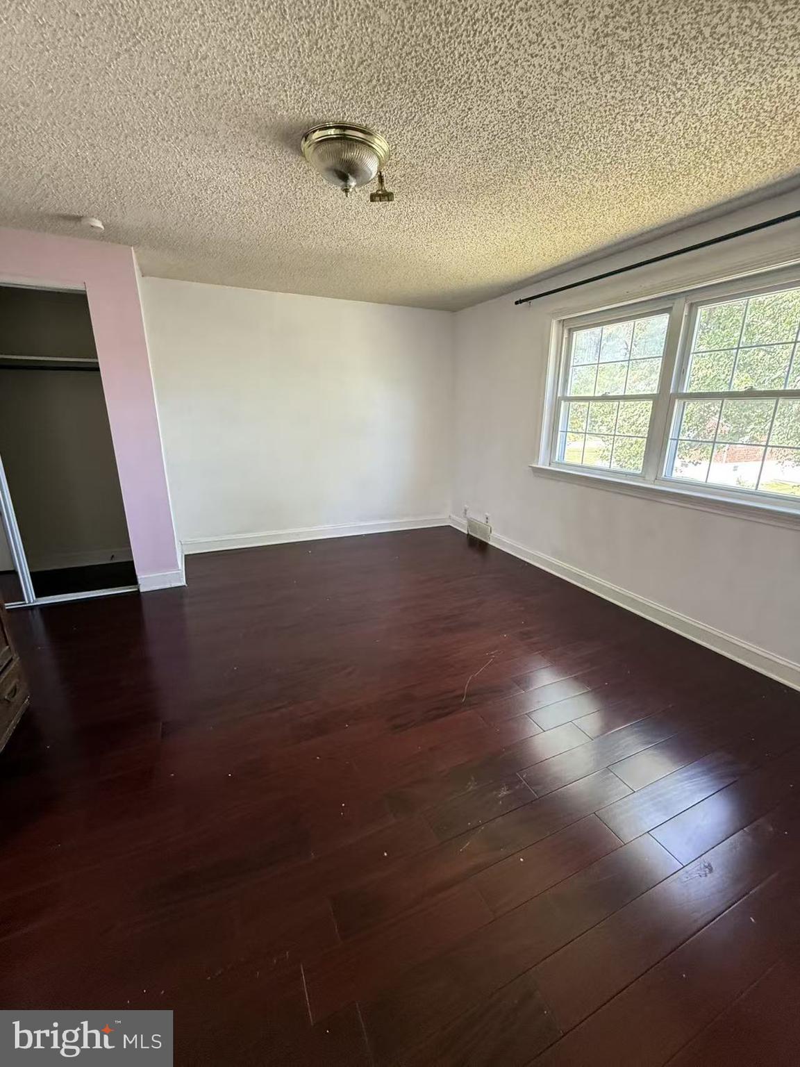 7640 Fairfield Street Philadelphia, PA 19152 - Photo 20 of 24 an empty room with wooden floor and windows